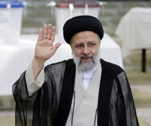 epa09284834 (FILE) - Iranian presidential candidate Ebrahim Raisi greets media  after casting his vote during the presidential elections in a mosque in Shahre Ray, southern of Tehran, Iran, 18 June 2021 (Reissued 19 June 2021). According to an interior ministry official, Raisi won 17.8 million votes, so far. More than 28 million Iranians out of 59 million eligible voters had cast thier ballots in the Iranian Presidential election.  EPA/ABEDIN TAHERKENAREH