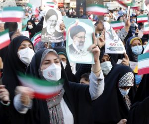 epa09286221 Supporters of Iranian president elect Ebrahim Raisi celebrate in Imam Hussein square in Tehran, Iran, 19 June 2021. According to an interior ministry official, Raisi with 17.9 million votes won the presidential election. More than 28 million Iranians out of 59 million eligible voters had cast their ballots in the Iranian Presidential election.  EPA/ABEDIN TAHERKENAREH