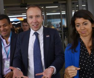 epa09302499 (FILE) - Britain's Health Secretary Matt Hancock (C) and aide Gina Coladangelo (R) attend the Conservative Party Conference  in Manchester, Britain, 29 September 2019 (reissued 26 June 2021). In a statement sent to media, Hancock apologized for breaking social distancing rules after a video emerged of him appearing to hug and kiss his aide Gina Coladangelo.  EPA/NEIL HALL *** Local Caption *** 55505745