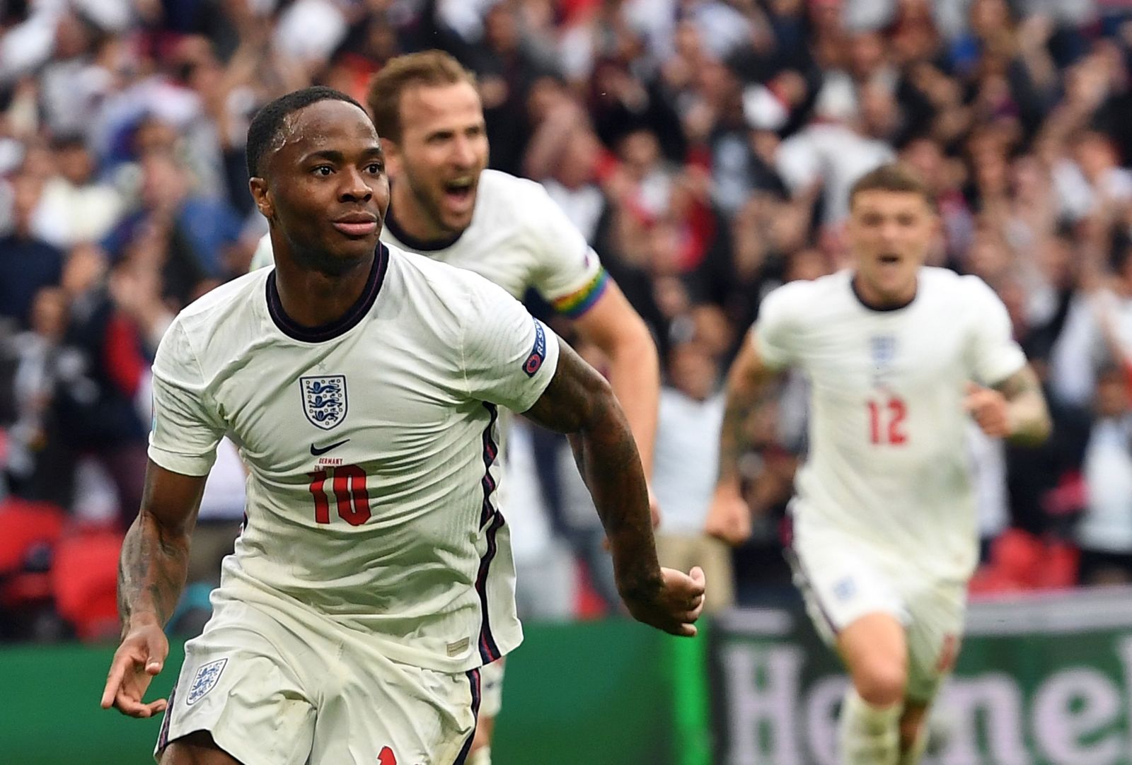 epa09311537 Raheem Sterling of England celebrates scoring  the 1-0 during the UEFA EURO 2020 round of 16 soccer match between England and Germany in London, Britain, 29 June 2021.  EPA/Andy Rain / POOL (RESTRICTIONS: For editorial news reporting purposes only. Images must appear as still images and must not emulate match action video footage. Photographs published in online publications shall have an interval of at least 20 seconds between the posting.)