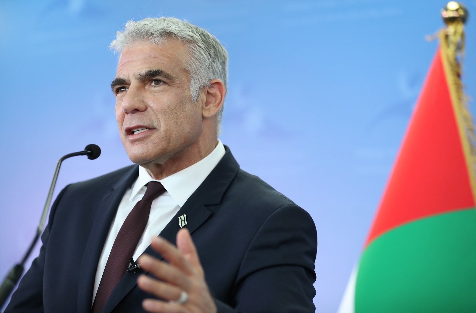 epa09312768 Israeli Foreign Minister Yair Lapid speaks during a press briefing from the Israeli consulate general at the Index Tower, Dubai, United Arab Emirates, 30 June 2021. Lapid arrived to the UAE on 29 June for a two-day official visit, the highest level visit by an Israeli official since the two countries announced the normalization of their relation in September 2020.  EPA/ALI HAIDER