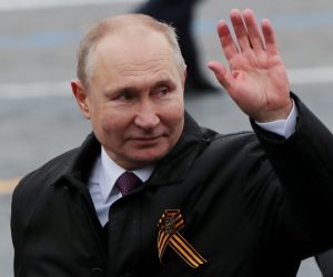 FILE PHOTO: FILE PHOTO: Victory Day Parade in Moscow FILE PHOTO: Russian President Vladimir Putin waves while walking along Red Square after a military parade on Victory Day, which marks the 76th anniversary of the victory over Nazi Germany in World War Two, in central Moscow, Russia May 9, 2021. REUTERS/Evgenia Novozhenina/File Photo/File Photo EVGENIA NOVOZHENINA