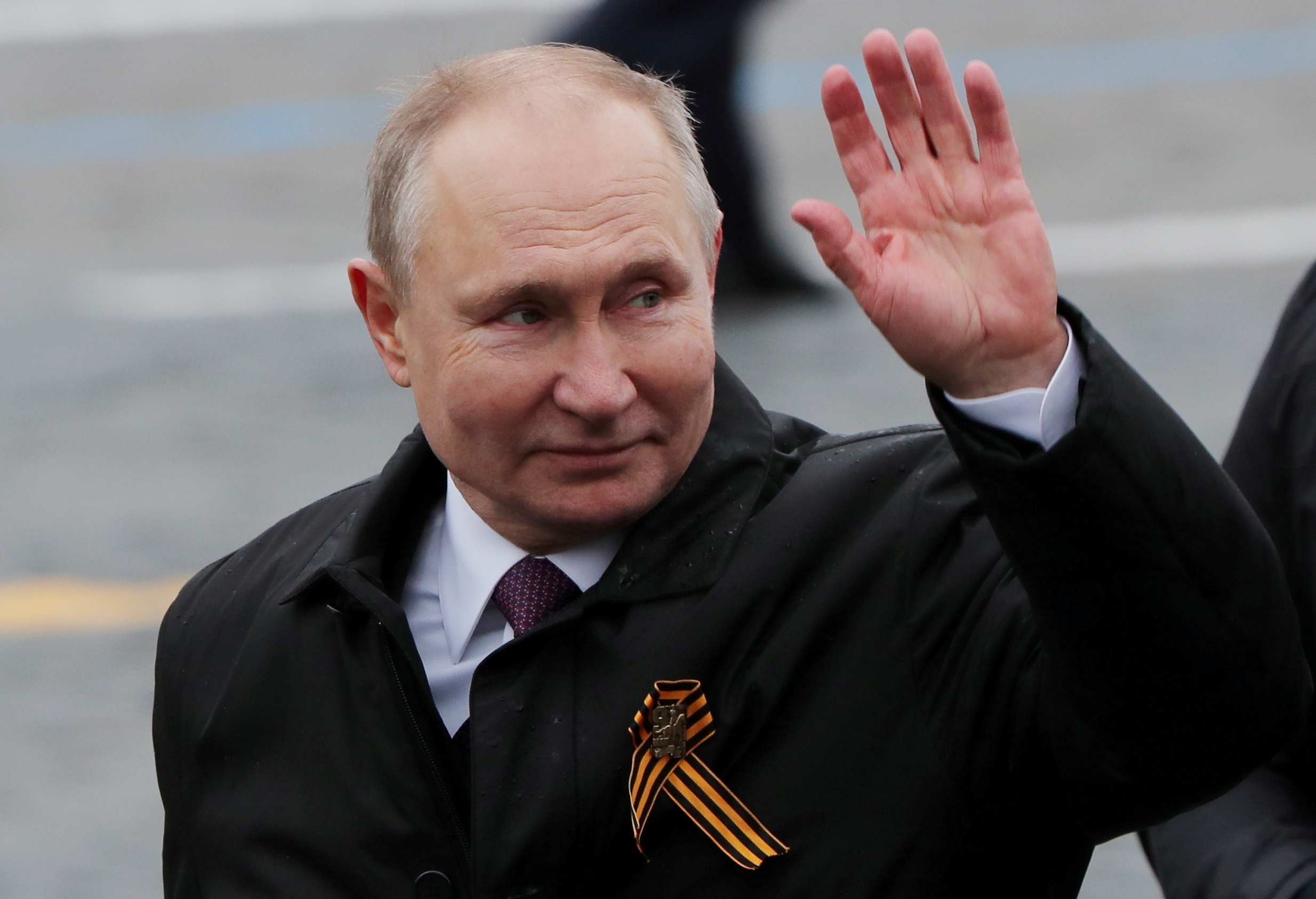 FILE PHOTO: FILE PHOTO: Victory Day Parade in Moscow FILE PHOTO: Russian President Vladimir Putin waves while walking along Red Square after a military parade on Victory Day, which marks the 76th anniversary of the victory over Nazi Germany in World War Two, in central Moscow, Russia May 9, 2021. REUTERS/Evgenia Novozhenina/File Photo/File Photo EVGENIA NOVOZHENINA