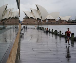 FILE PHOTO: A runner exercises near the Opera House in Sydney FILE PHOTO: A runner exercises along the waterfront near the Sydney Opera House in Sydney, Australia, June 10, 2021.  REUTERS/Loren Elliott/File Photo LOREN ELLIOTT