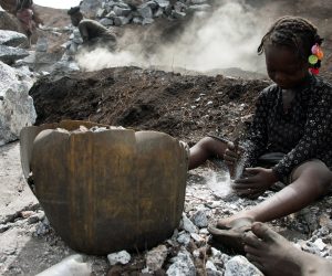 FILE PHOTO: Outbreak of the coronavirus disease (COVID-19), in Ouagadougou FILE PHOTO: Oumeima Ouedraogo, 7, crashes stones next to burning tires at the Pissy informal granite quarry since schools closed amid the outbreak of the  coronavirus disease (COVID-19), in Ouagadougou, Burkina Faso June 12, 2020. Picture taken June 12,  2020. REUTERS / Anne Mimault/File Photo Anne Mimault