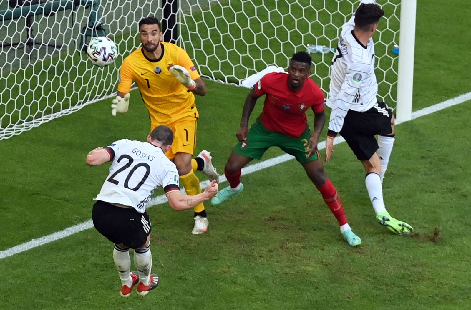 epa09286473 Robin Gosens (L) of Germany scores the 1-4 goal during the UEFA EURO 2020 group F preliminary round soccer match between Portugal and Germany in Munich, Germany, 19 June 2021.  EPA/Matthias Hangst / POOL (RESTRICTIONS: For editorial news reporting purposes only. Images must appear as still images and must not emulate match action video footage. Photographs published in online publications shall have an interval of at least 20 seconds between the posting.)