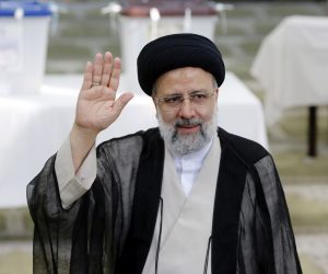 epa09284834 (FILE) - Iranian presidential candidate Ebrahim Raisi greets media  after casting his vote during the presidential elections in a mosque in Shahre Ray, southern of Tehran, Iran, 18 June 2021 (Reissued 19 June 2021). According to an interior ministry official, Raisi won 17.8 million votes, so far. More than 28 million Iranians out of 59 million eligible voters had cast thier ballots in the Iranian Presidential election.  EPA/ABEDIN TAHERKENAREH