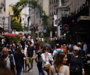 epa09279459 People without protective face mask walk along Montorgueil street in Paris, France, 17 June 2021. France eases some of its COVID-19 restrictions starting on 17 June, allowing not wearing a face mask in the streets.  EPA/YOAN VALAT