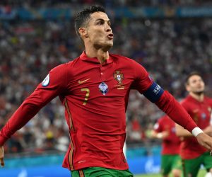 epa09296891 Cristiano Ronaldo of Portugal celebrates after scoring the 1-0 by penalty during the UEFA EURO 2020 group F preliminary round soccer match between Portugal and France in Budapest, Hungary, 23 June 2021.  EPA/Tibor Illyes / POOL (RESTRICTIONS: For editorial news reporting purposes only. Images must appear as still images and must not emulate match action video footage. Photographs published in online publications shall have an interval of at least 20 seconds between the posting.)