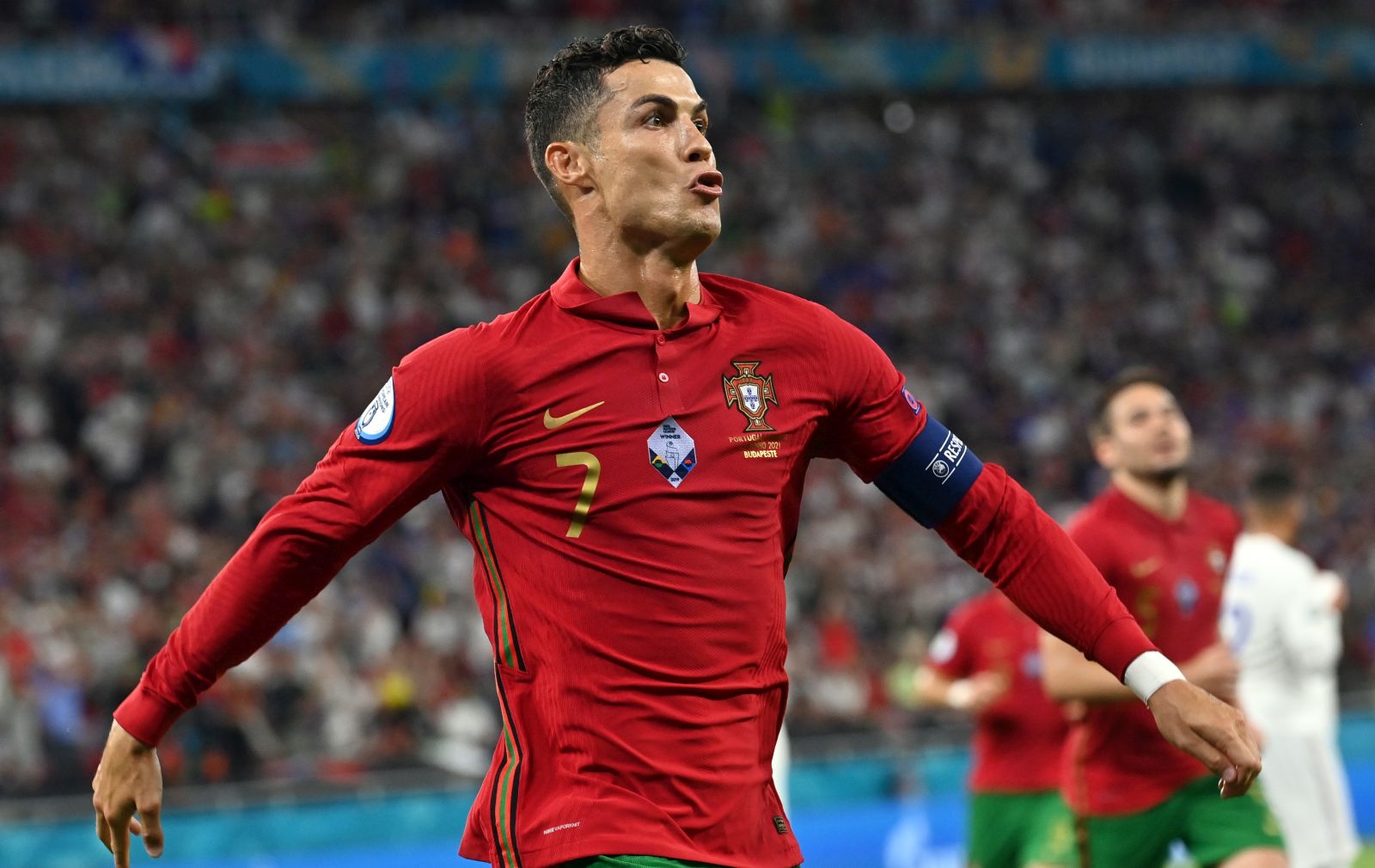 epa09296891 Cristiano Ronaldo of Portugal celebrates after scoring the 1-0 by penalty during the UEFA EURO 2020 group F preliminary round soccer match between Portugal and France in Budapest, Hungary, 23 June 2021.  EPA/Tibor Illyes / POOL (RESTRICTIONS: For editorial news reporting purposes only. Images must appear as still images and must not emulate match action video footage. Photographs published in online publications shall have an interval of at least 20 seconds between the posting.)