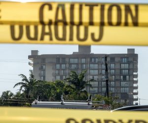 epa09322243 The partially collapsed Champlain Towers South condominium building is seen from the West in Surfside, Florida, USA, 04 July 2021. City officials decided to demolish the remaining part of Champlain Towers South with explosives, accelerating their plans due to an approaching tropical storm Elsa.  EPA/CRISTOBAL HERRERA-ULASHKEVICH