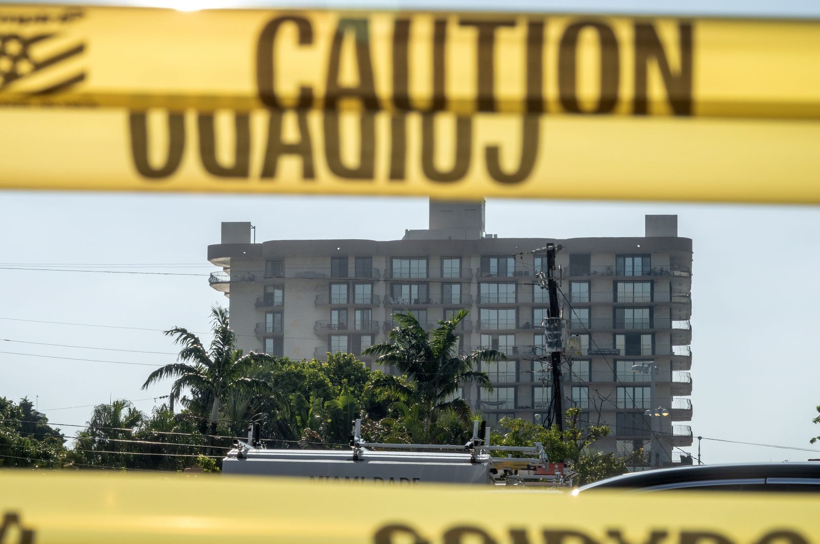 epa09322243 The partially collapsed Champlain Towers South condominium building is seen from the West in Surfside, Florida, USA, 04 July 2021. City officials decided to demolish the remaining part of Champlain Towers South with explosives, accelerating their plans due to an approaching tropical storm Elsa.  EPA/CRISTOBAL HERRERA-ULASHKEVICH