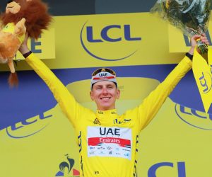 epa09326070 Slovenian rider Tadej Pogacar of the UAE-Team Emirates celebrates on the podium after retaining the overall leader's yellow jersey following the 10th stage of the Tour de France 2021 over 190.7 km from Albertville to Valence, France, 06 July 2021.  EPA/CHRISTOPHE PETIT-TESSON