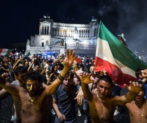 epa09327744 Italy fans celebrate their team's victory in the UEFA EURO 202 semi final match between Italy and Spain at Piazza Venezia, Rome, Italy, 06 July 2021.  EPA/ANGELO CARCONI