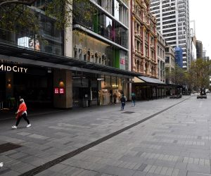 epa09354265 Few pedestrians on the empty Pitt Street Mall in the central business district in Sydney, Australia, 20 July 2021. The stay-at-home orders for coronavirus-hit Greater Sydney and surrounds have been tightened with non-essential retail to close and all construction paused until 30 July.  EPA/JOEL CARRETT AUSTRALIA AND NEW ZEALAND OUT