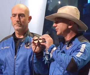 epa09355317 A frame grab from a Blue Origin handout video showing Jeff Bezos (R) and Mark Bezos during a press conference after Blue Origin New Shepard made a trip to space following lift off from Launch Site One, Texas, USA, 20 July 2021.  EPA/BLUE ORIGIN / HANDOUT  HANDOUT EDITORIAL USE ONLY/NO SALES