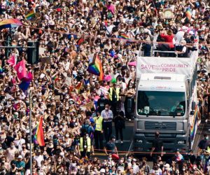 epa09362340 Participants move next to a truck on Leipziger Strasse as they attend the 'CSD Berlin 2021' Christopher Street Day parade in Berlin, Germany, 24 July 2021. Due to the Coronavirus pandemic that causes the Covid-19 disease, this year's CSD demonstration only consists of five trucks and an expected crowd of some 20,000 participants. CSD is an annual European LGBTIQA* (lesbian, gay, bisexual, transgender, intersex, queer/questioning, asexual) celebration held in various cities across Europe for the rights of LGBTIQA* people.  EPA/CLEMENS BILAN