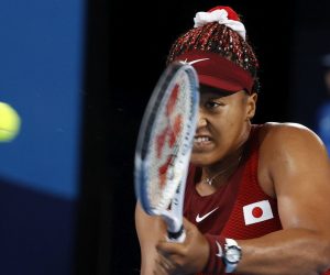 epa09368822 Naomi Osaka of Japan in action against Marketa Vondrousova of the Czech Republic during the Women's Singles Third Round Tennis events of the Tokyo 2020 Olympic Games at the Ariake Coliseum in Tokyo, Japan, 27 July 2021.  EPA/MICHAEL REYNOLDS