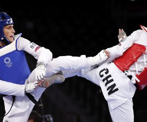epa09369106 Hongyi Sun of China (red) fights with Ivan Sapina of Croatia in the Men's +80kg quarterfinal during the Taekwondo events of the Tokyo 2020 Olympic Games at the Makuhari Messe convention centre in Chiba, Japan, 27 July 2021.  EPA/RITCHIE B. TONGO