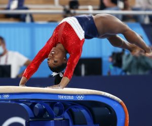 epa09370180 Simone Biles of the USA performs on the Vault during the Women's Team final during the Artistic Gymnastics events of the Tokyo 2020 Olympic Games at the Ariake Gymnastics Centre in Tokyo, Japan, 27 July 2021.  EPA/HOW HWEE YOUNG