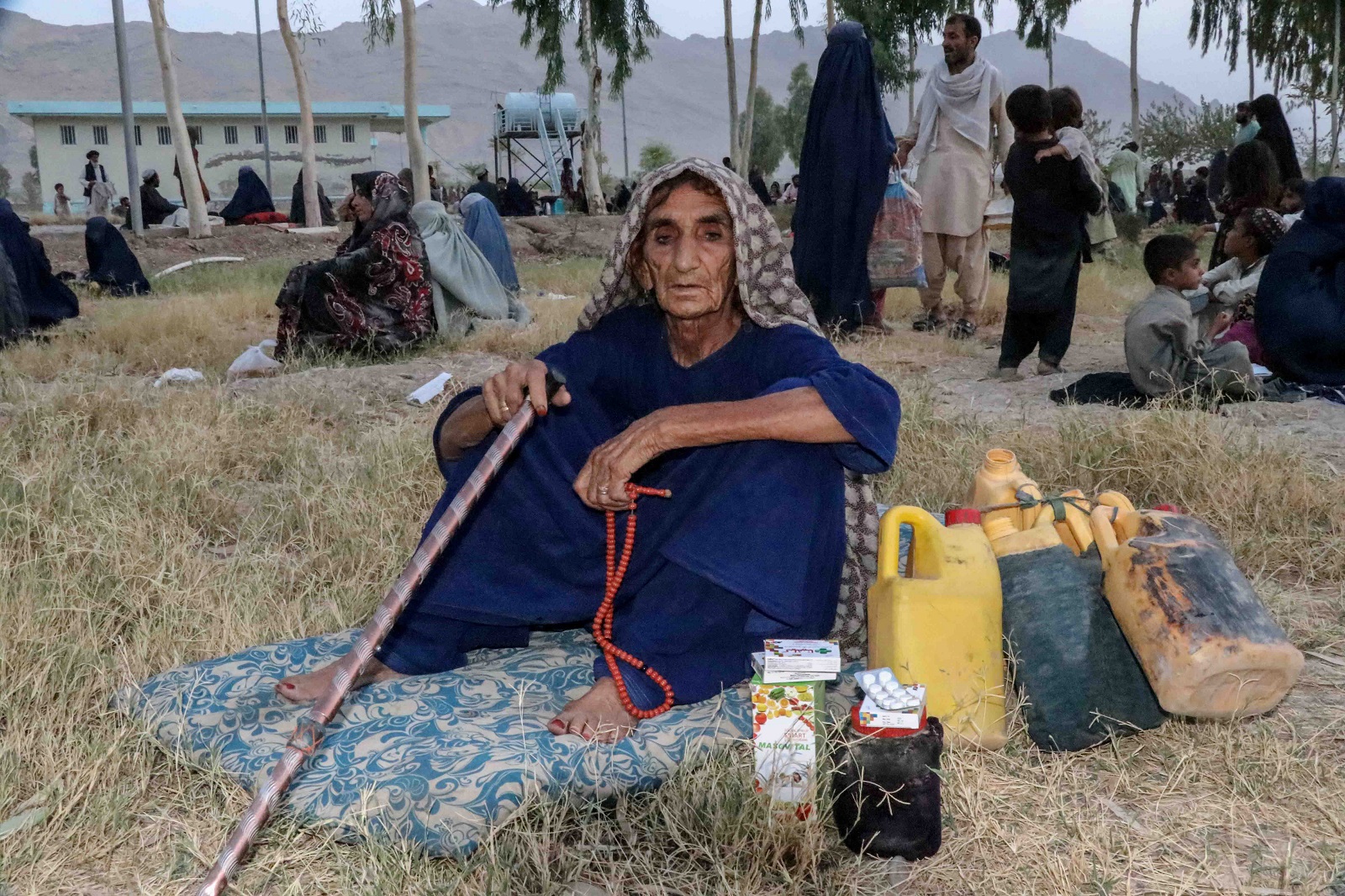 epa09371743 Families displaced from districts where fighting is going on between Afghan security forces and the Taliban, wait for relief as they live in temporary shelters in Kandahar, Afghanistan, 27 July 2021. Civilian casualties in the armed conflict in Afghanistan increased by 47 percent in first six months of 2021 compared to the same period last year, according to the latest report by United Nations on 26 July 2021. This spike is mainly due to an increase in Taliban offensives in the wake of the withdrawal of the United States and NATO forces from Afghanistan starting May 1.  EPA/M. SADIQ