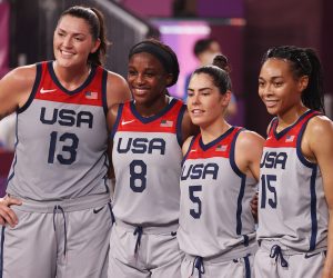 epa09374297 (L-R) Stefanie Dolson, Jackie Young, Kelsey Plum and Allisha Gray pose for a photograph after winning the Women's Gold Medal Game between the United States and Russia during the 3x3 Basketball events of the Tokyo 2020 Olympic Games at the Aomi Urban Sports Park in Tokyo, Japan, 28 July 2021.  EPA/FAZRY ISMAIL