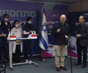 epa09379164 Israeli Prime Minister Naftali Bennett (2-R) speaks to journalists with President Isaac Herzog (R), who received a third COVID-19 vaccine injection at Sheba Medical Center in Ramat Gan, Israel, 30 July 2021.  EPA/MAYA ALLERUZZO / POOL
