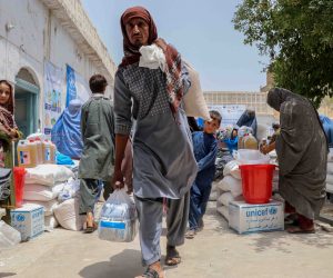 epa09380493 Afghans attend a ceremony organized by the United States Agency for International Development (USAID) to distribute relief supplies to families displaced from districts where fighting is ongoing between Afghan security forces and the Taliban, in Kandahar, Afghanistan, 30 July 2021. Civilian casualties in the armed conflict in Afghanistan increased by 47 percent in first six months of 2021 compared to the same period last year, according to the latest report by United Nations on 26 July 2021. This spike is mainly due to an increase in Taliban offensives in the wake of the withdrawal of the United States and NATO forces from Afghanistan starting 01 May.  EPA/M. SADIQ