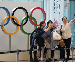 epa09330749 Visitors take a selfie with the Olympic Rings monument set at an arrival terminal of Tokyo International Airport at Haneda, Japan, 08 July 2021. Japanese government decided on 08 July 2021 to declare the fourth state of emergency for Tokyo, Japan, from 12 July 2021 through 22 August 2021 including the period of Tokyo 2020 Olympic Games. Japan prepare to declare a state of emergency for Tokyo and Okinawa. IOC and Tokyo 2020 Organising Committee will have a five-party talks to set formal decision on spectators for the Summer Games.  EPA/KIMIMASA MAYAMA