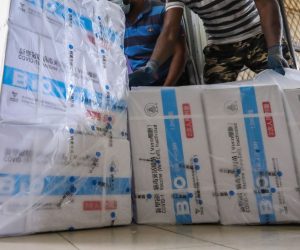 epa09369293 Sri Lankan workers unload a newly arrived shipment of the Chinese Sinopharm Covid-19 vaccine at the Medical Supplies Division in Colombo, Sri Lanka, 27  July 2021. According to the health ministry, the Chinese government donated 1.6 million doses of the Chinese Sinopharm Covid-19 vaccine to Sri Lanka on 27 July 2021. Sri Lanka is currently using Oxford AstraZeneca, China's Sinopharm, Russian Sputnik V, and Moderna Covid -19 vaccines for the Vaccine rollout.  EPA/CHAMILA KARUNARATHNE