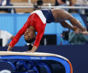 epa09370180 Simone Biles of the USA performs on the Vault during the Women's Team final during the Artistic Gymnastics events of the Tokyo 2020 Olympic Games at the Ariake Gymnastics Centre in Tokyo, Japan, 27 July 2021.  EPA/HOW HWEE YOUNG