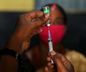 epaselect epa09370569 A health worker prepares a syringe for a COVID-19 vaccine during a vaccination drive for underprivileged, in Bangalore, India, 27 July 2021. India has vaccinated over 440 million people against Coronavirus COVID-19 according to the health ministry.  EPA/JAGADEESH NV