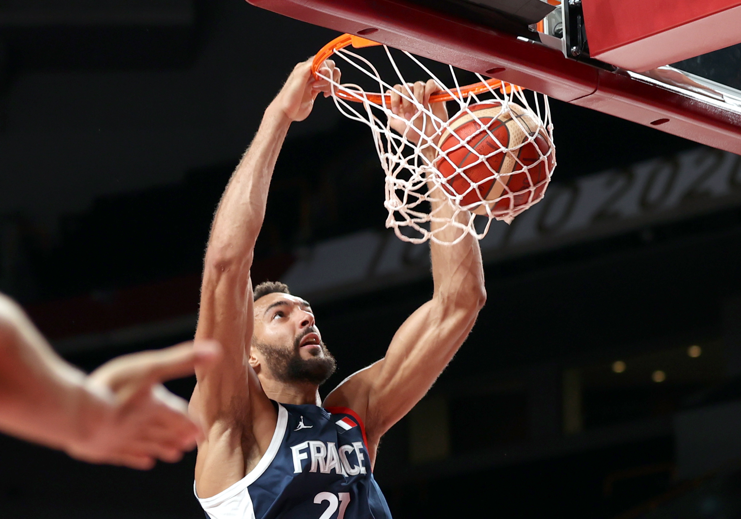 epa09374194 Rudy Gobert of France slam dunk during the Men's Basketball preliminary round Group B match between Czech Republic and France at the Tokyo 2020 Olympic Games at the Saitama Super Arena in Saitama, Japan, 28 July 2021.  EPA/WU HONG