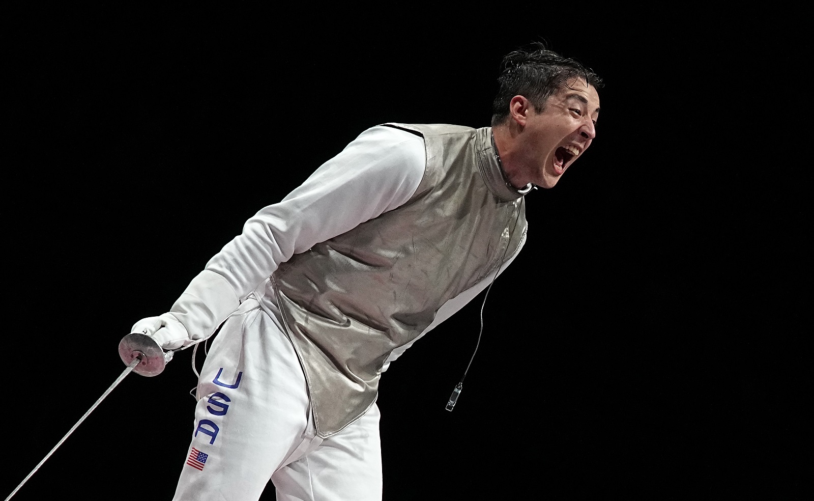 epa09385032 lexander Massialas of US reacts after defeating Kyosuke Matsuyama of Japan in the Fencing Men's Foil Team Bronze medal match between US and Japan during the Tokyo 2020 Olympic Games at the Makuhari Messe convention centre in Chiba, Japan, 01 August 2021.  EPA/NIC BOTHMA