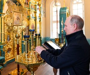 epa09385501 Russian President Vladimir Putin lights a candle visiting the Konevsky Monastery on Konevets Island on Ladoga Lake in Leningrad region, 31 July 2021 (Issued 01 August 2021). The monastery, built at the beginning of the 19th century, was later practically destroyed. In 2016, Vladimir Putin visited Konevets and gave instructions to restore the main temple and skete of the Konevskaya Icon of the Mother of God. To date, the monastery has been restored by the forces and means of Russian oil company 'Rosneft'.  EPA/ALEXEI NIKOLSKY/SPUTNIK/KREMLIN POOL / POOL