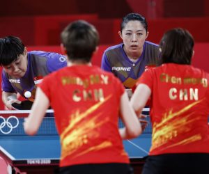 epa09390160 Ye Lin (L) and Mengyu Yu (2-R) of Singapore in action against Manyu Wang and Meng Chen of China during the women's team quarterfinal table tennis match at the Tokyo 2020 Olympic Games at the Tokyo Metropolitan Gymnasium arena in Tokyo, Japan, 03 August 2021.  EPA/MAST IRHAM