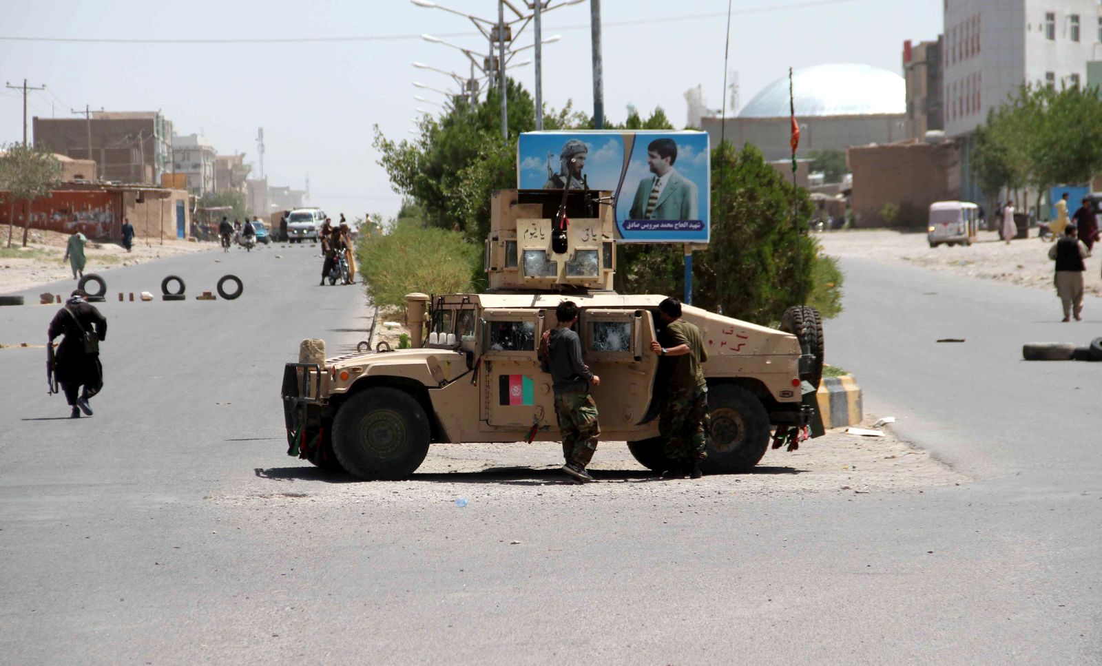 epa09400533 Afghan security officials patrol after they took back control of parts of Herat city following intense battle with Taliban militants, in Herat, Afghanistan, 06 August 2021. Heavy fighting continued in Kandahar, Lashkargah, and Herat cities as the Taliban continued pressing on with their surge in Afghanistan and breaking through a tough resistance by the government forces. The fighting in Herat displaced hundreds of families as people left their houses to seek refuge in central parts of the city, mostly settling with relatives.  EPA/JALIL REZAYEE