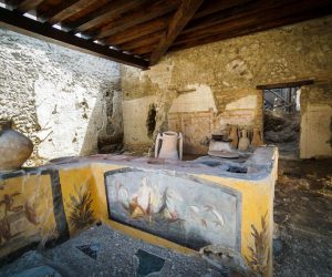 epa09401737 A view into the reopened thermopoly, in Pompeii, Italy 06 August 2021. The thermopoly (Thermopolium), or how the archeological excavation site describes it on their the website: the 'Snack Bar' of the Regio V of Pompeii, was reopened the same day. The ancient commercial area that has been partially excavated in 2019, is now fully visible and features colorful mosaics and paintings, such as one of a 'Nereid riding a sea-horse' (C) or 'other rich decorative still lifes, food residues, animal bones and victims of the eruption', the website explains.  EPA/CESARE ABBATE