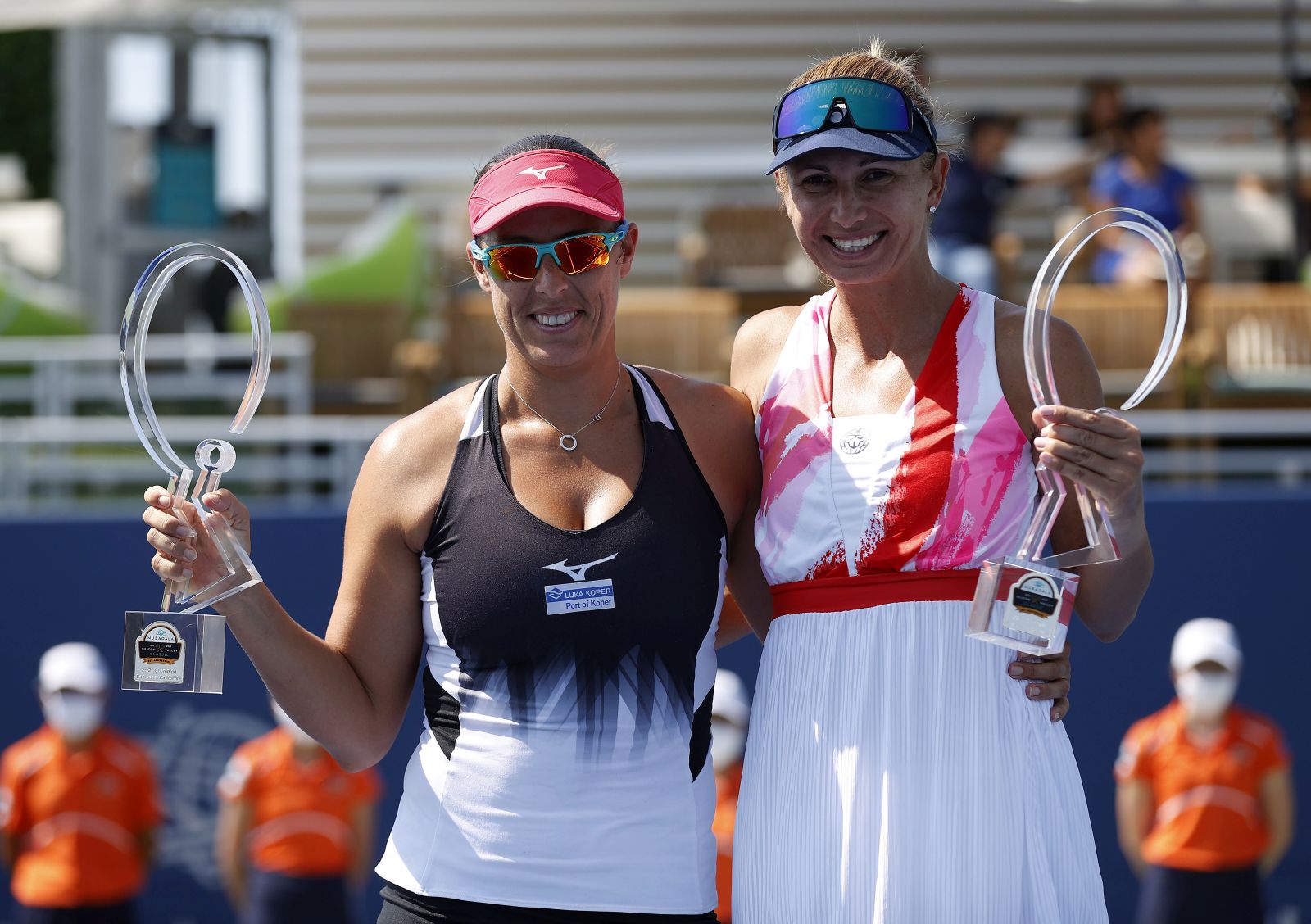 epa09406807 Darija Jurak of Croatia (R) and Andreja Klepac of Slovenia (L) pose with their trophies after defeating Gabriela Dabrowski of Canada and Luisa Stefani of Brazil at the conclusion of their doubles finals match of the women's Mubadala Silicon Valley Classic tennis tournament at San Jose State University in San Jose, California, USA, 08 August 2021.  EPA/JOHN G. MABANGLO