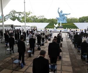 epa09406890 People observe a moment of silence during a ceremony at Peace Park in Nagasaki, southern Japan, 09 August 2021. Nagasaki marks the 76th anniversary of the atomic bombing on 09 August 1945, as related events are either canceled or scaled down this year to avoid the spreading of the coronavirus and COVID-19 disease pandemic.  EPA/JIJI PRESS JAPAN OUT EDITORIAL USE ONLY/  NO ARCHIVES