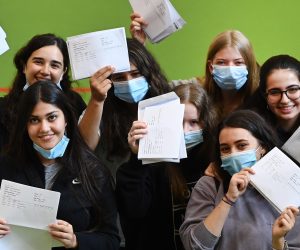 epa09408011 Students show off their A-level exam results at a school in London, Britain, 10 August 2021. Students across the UK are set to receive their A-level exam results 10 August.  High grades are expected as grades are teacher assessed based on a wide range of evidence, due to the coronavirus pandemic. Hundreds of thousands of students are expected to apply for university with many missing out on their first choice due to fierce competition for places.  EPA/ANDY RAIN