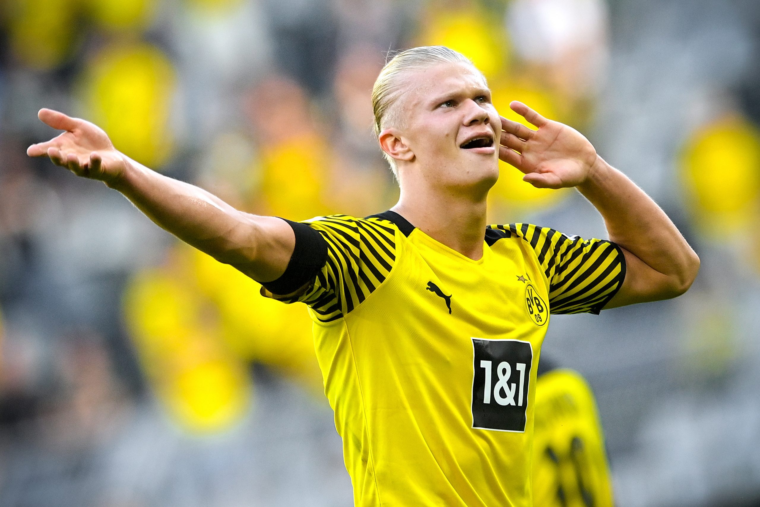 epa09413959 Dortmund's Erling Haaland celebrates after scoring the 3-1 lead during the German Bundesliga soccer match between Borussia Dortmund and Eintracht Frankfurt in Dortmund, Germany, 14 August 2021.  EPA/SASCHA STEINBACH CONDITIONS - ATTENTION: The DFL regulations prohibit any use of photographs as image sequences and/or quasi-video.