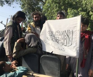 epa09415067 Taliban militants display their flag after taking control of Jalalabad, in Nangarhar province, Afghanistan, 15 August 2021. The Taliban have reached the outskirts of Kabul, the capital city of Afghanistan, where the Afghan government reported there have been shots heard, although the insurgents said they will not enter the city by force and are negotiating a peaceful transition of power.  EPA/STRINGER