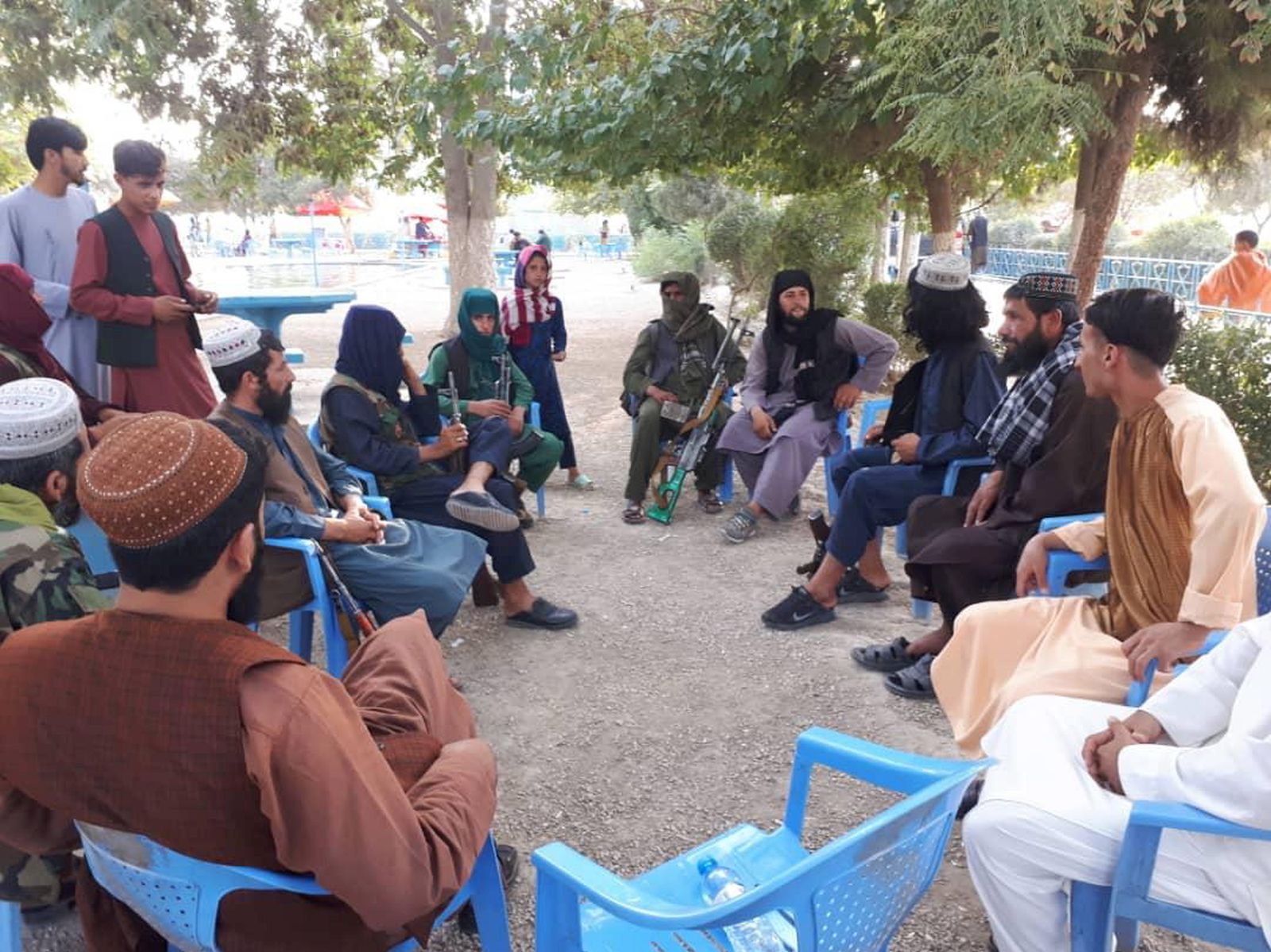 epa09415593 Taliban gather for a meeting at a park in Mazar-e-Sharif, Afghanistan, 15 August 2021. The Taliban entered Kabul on 15 August, despite having initially claimed they would not come in until a transfer of power was agreed upon, while President of Afghanistan Ashraf Ghani left the country.  EPA/STRINGER