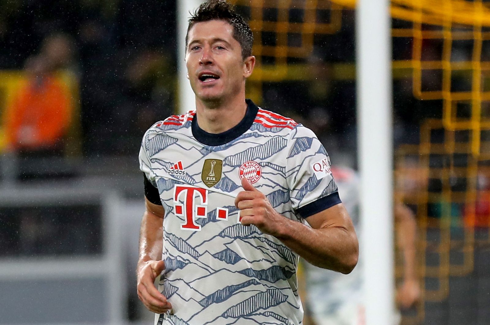 epa09418296 Bayern's Robert Lewandowski (R) celebrates after scoring the opening goal during the DFL Supercup 2021 soccer match between Borussia Dortmund and FC Bayern Muenchen in Dortmund, Germany, 17 August 2021.  EPA/FRIEDEMANN VOGEL CONDITIONS - ATTENTION: The DFL regulations prohibit any use of photographs as image sequences and/or quasi-video.