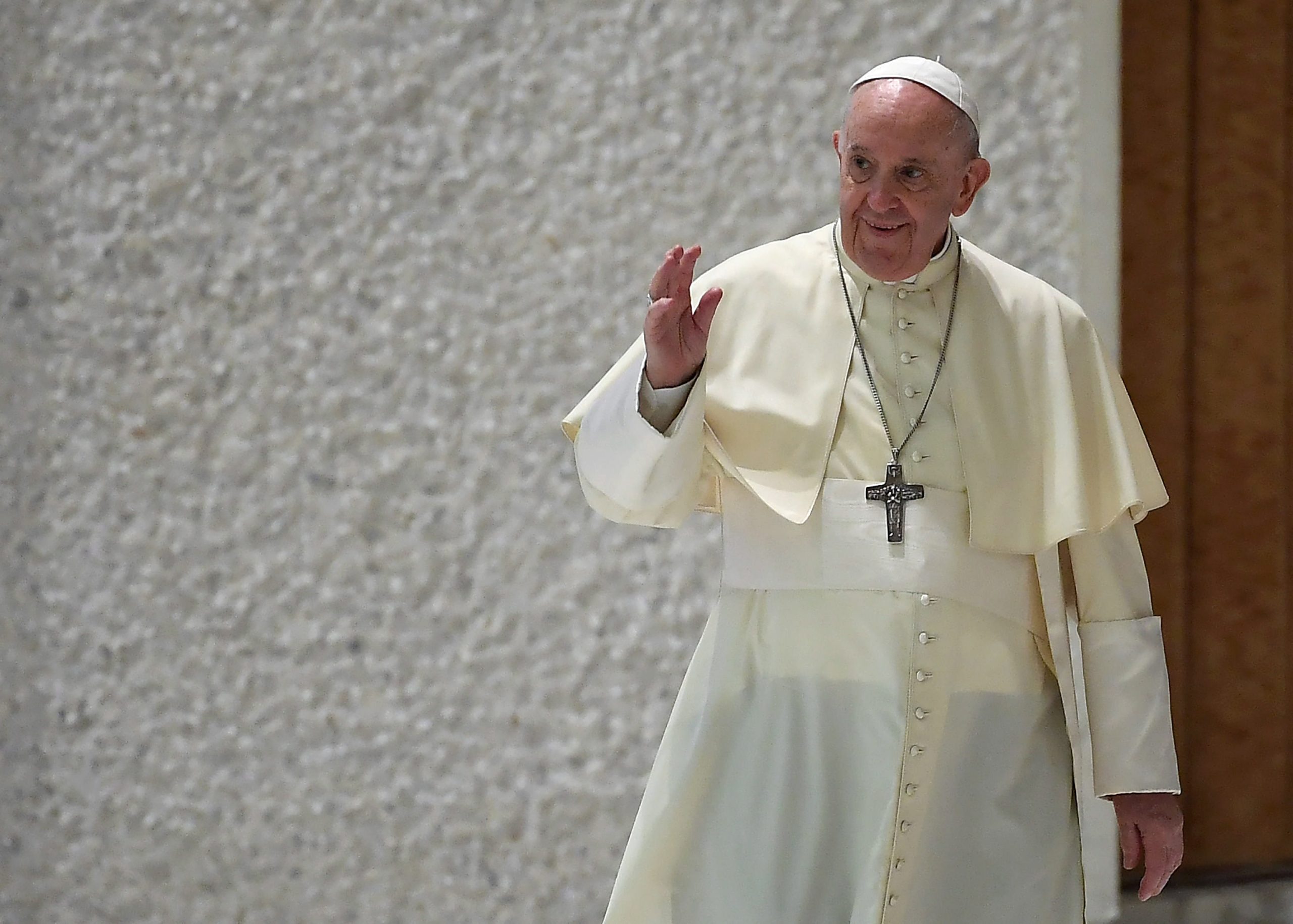 epa09428459 Pope Francis greets faithful as he arrives to lead the weekly general audience in Paolo VI Hall , Vatican City,  25 August 2021.  EPA/ETTORE FERRARI