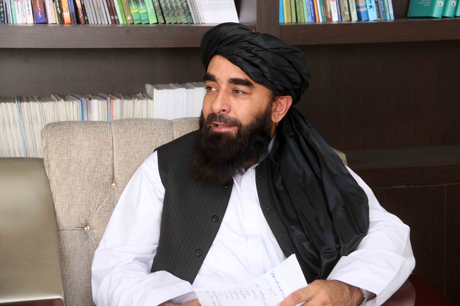 epa09428821 Taliban spokesman Zabiullah Mujahid during an interview at his office in Kabul, Afghanistan, 25 August 2021. Taliban spokesperson Zabiullah Mujahid said the group hopes to reach an agreement of an inclusive government soon. He said that the group wants better relations with international community and hopes that the international community will accept their government.  EPA/AKHTER GULFAM