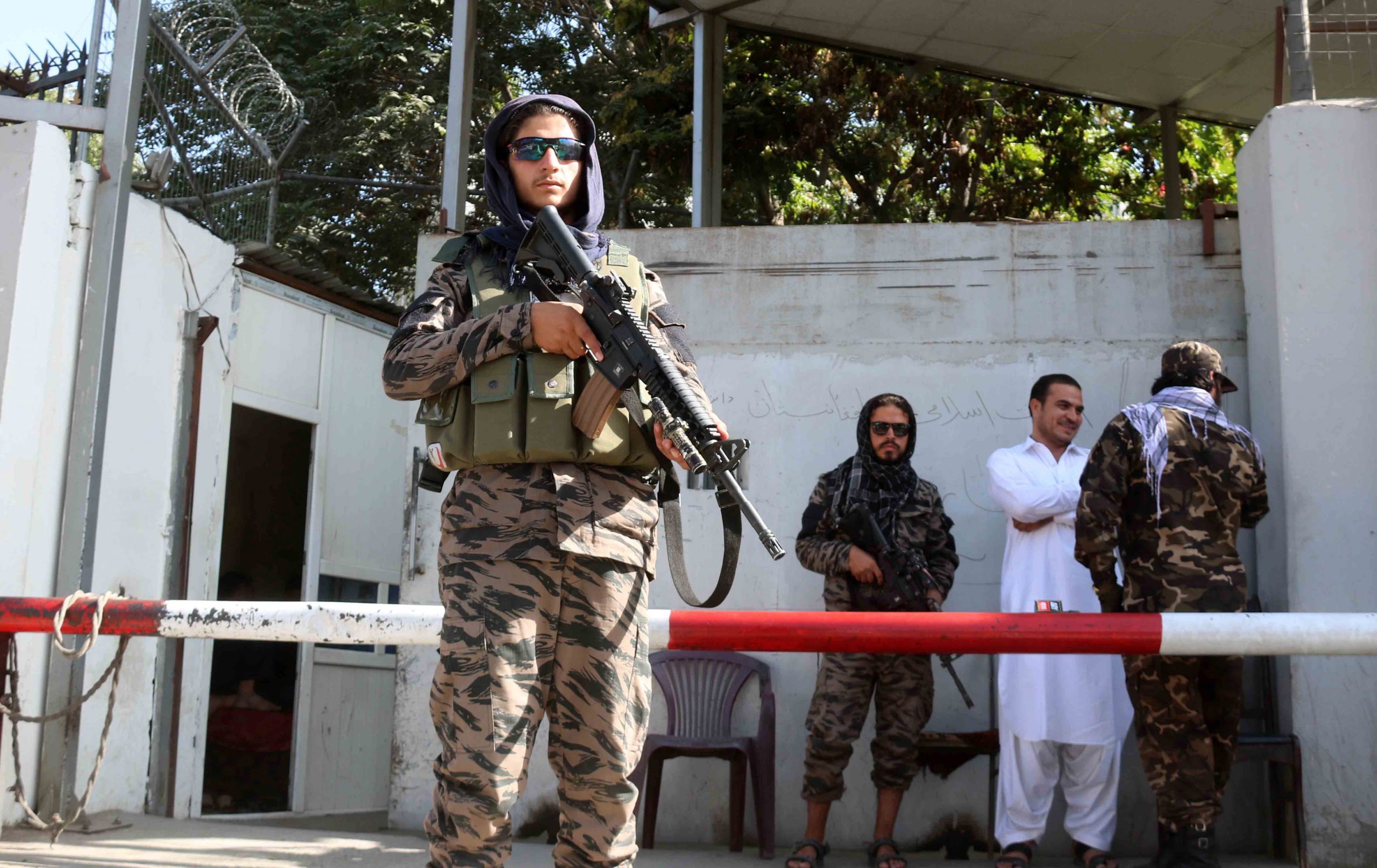 epa09428816 Taliban stands guard outside the office of Taliban's spokesman Zabiullah Mujahid, in Kabul, Afghanistan, 25 August 2021. Taliban spokesperson Zabiullah Mujahid said the group hopes to reach an agreement of an inclusive government soon. He said that the group wants better relations with international community and hopes that the international community will accept their government.  EPA/AKHTER GULFAM