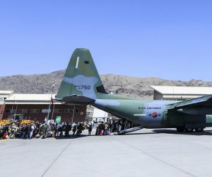 epa09429714 A handout photo made available by the Republic of Korea Air Force shows some 380 Afghans who have worked for South Koreans in their war-ravaged nation and their family members boarding a South Korea military plane at an airport in Kabul, Afghanistan, 25 August 2021, to head for South Korea.  EPA/REPUBLIC OF KOREA AIR FORCE / HANDOUT SOUTH KOREA OUT 
ATTENTION EDITORS: IMAGE PIXELATED AT SOURCE HANDOUT EDITORIAL USE ONLY/NO SALES