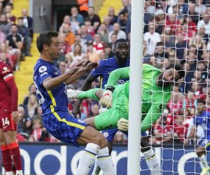 epa09434258 Liverpool’s goalkeeper Alisson Becker (R) concedes the opening goal during the English Premier League match between Liverpool and Chelsea in Liverpool, Britain, 28 August 2021.  EPA/ANDREW YATES EDITORIAL USE ONLY. No use with unauthorized audio, video, data, fixture lists, club/league logos or 'live' services. Online in-match use limited to 120 images, no video emulation. No use in betting, games or single club/league/player publications.